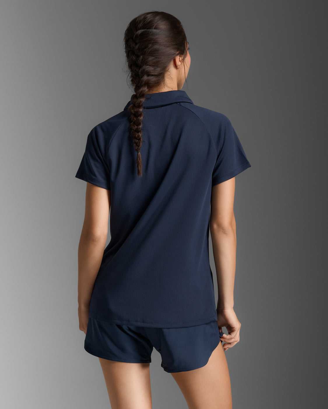 2xu-motion-aspire-polo-damen-midnight-white-kurzarm image 2